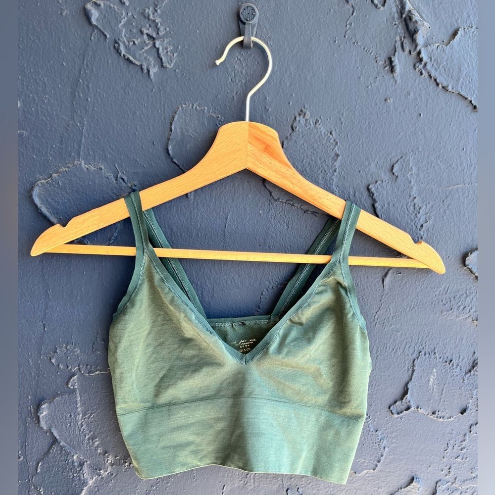 Out from under green bralette